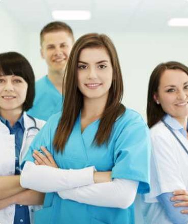 Smiling team of doctors and nurses